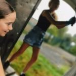 Some young people painting the shelter